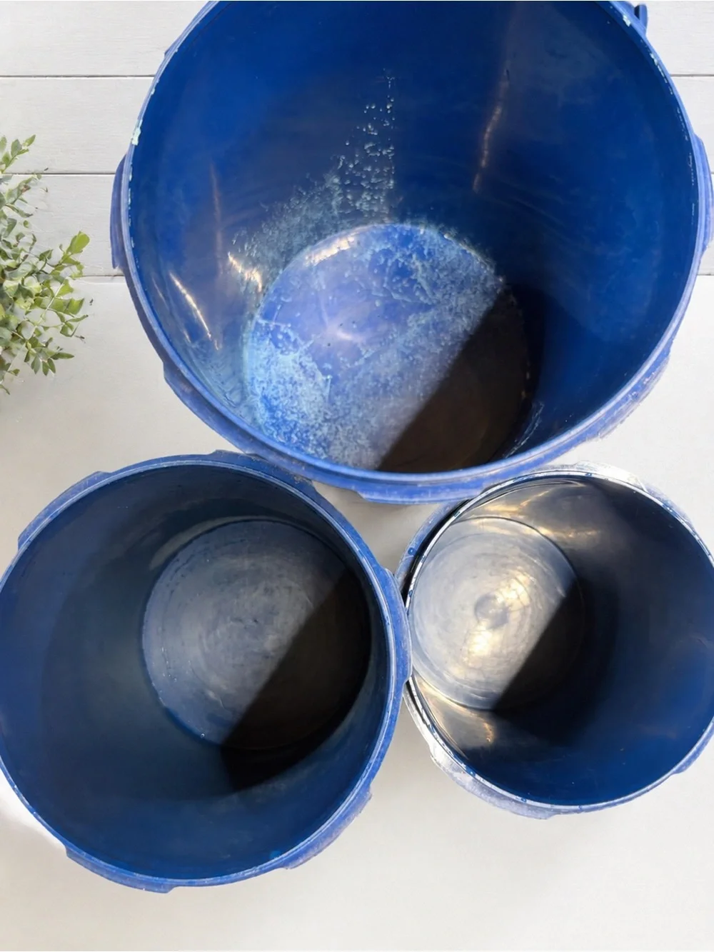 vintage dark blue Tupperware Servalier nesting canisters with a floral starburst